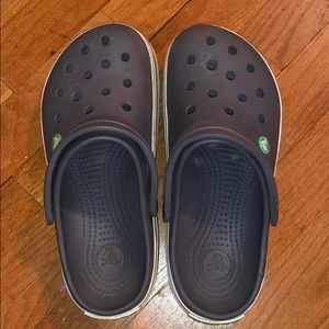 Gray with a green striped crocs